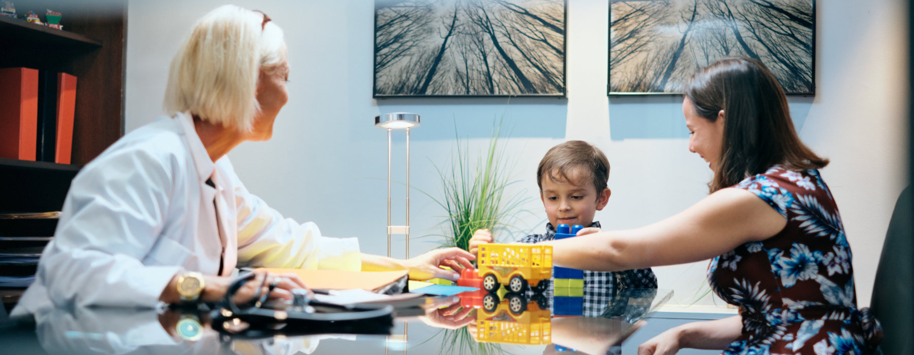 three person in a room playing